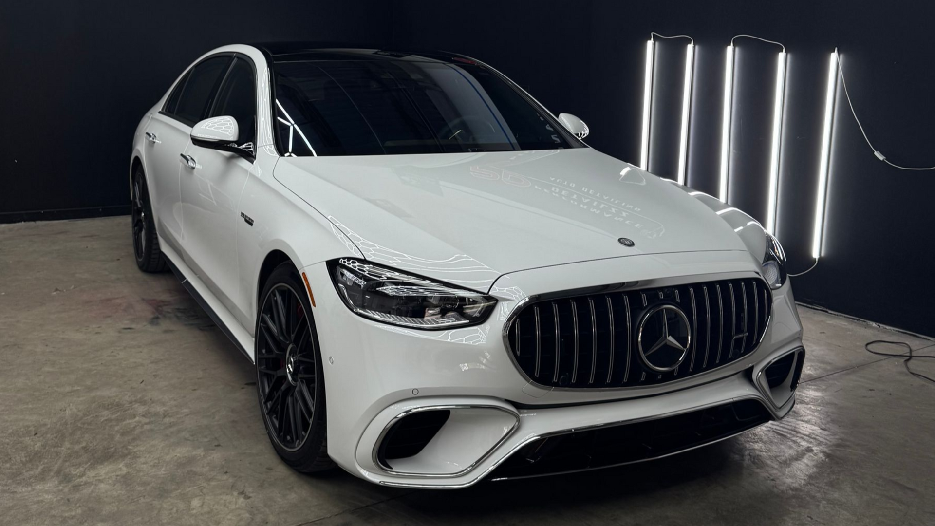 White Mercedes-Benz in the Good Vibes detailing studio